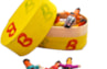 6 kleine zorgenpoppetjes in een geel doosje